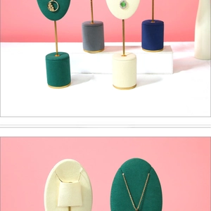Close-up of velvet jewelry display stands for necklaces in multiple colors