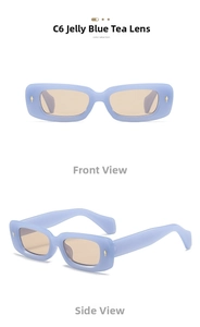 Detail view of rectangular jelly blue sunglasses with tea lenses and golden arrow metal accents