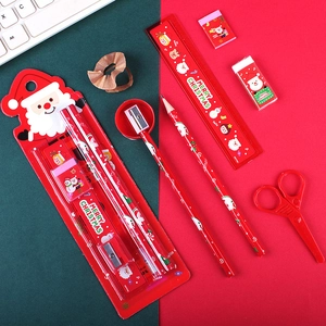 Christmas stationery gift set featuring Santa pencils and ruler in festive red colors
