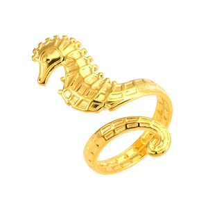 Macro view of detailed seahorse ring in 18k gold plating showing scale textures