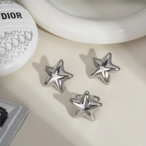 Three-piece silver star jewelry set with shiny polished finish and minimalist design
