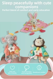 Detail of plush baby security blankets with animal designs and star-shaped teethers