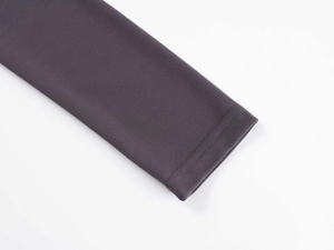 Detail of dark charcoal gray sleeve cuffs with reinforced double-stitch sewing quality