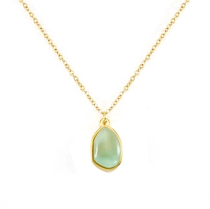 Close-up of irregular green natural stone pendant with gold-plated stainless steel chain