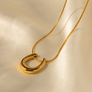 18K gold-plated stainless steel snake chain necklace with a polished U-shaped pendant