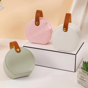 Portable Round Jewelry Box PU Leather Travel Jewelry Organizer For Rings Earrings Necklaces Storage Case With Handle