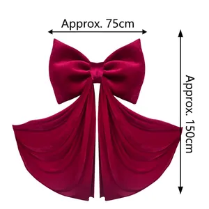 Detailed view of giant burgundy velvet bow measuring approx. 75x150cm for event decor