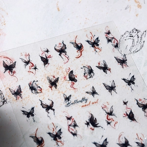 Ink butterfly nail art stickers with vintage black and red patterns on transparent film