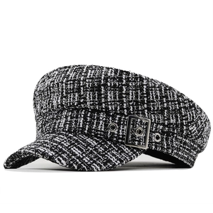Classic black and white tweed newsboy hat with silver metal buckle and flat top