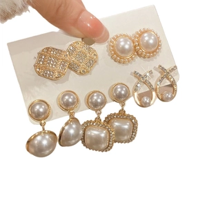 Elegant gold pearl earring set with rhinestone accents in vintage French style