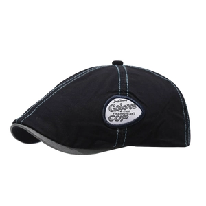 Classic black vintage flat cap with blue contrast stitching and retro side patch detail