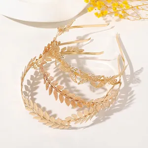 Three-piece gold metal headband set featuring elegant laurel leaves and hollow butterflies