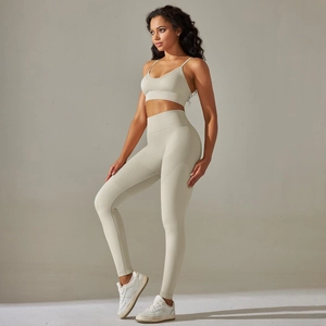 Full side view of cream knitted yoga set with V-neck bra and high waist leggings