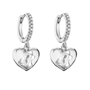 Detailed close-up of heart-shaped silver earrings with sparkling cubic zirconia pavé