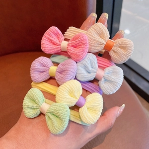 Detail showing colorful chiffon bow hair ties with thick elastic bands for girls