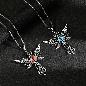 Gothic wings cross necklace with blue and red evil eye stones on silver metal chain