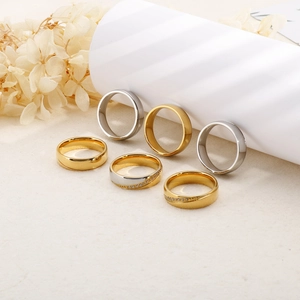 Detail showing 6mm polished stainless steel rings with diamond inlay in gold and silver finish