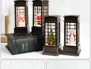 Detailed view of four vintage Christmas lantern telephone booths with warm LED lighting