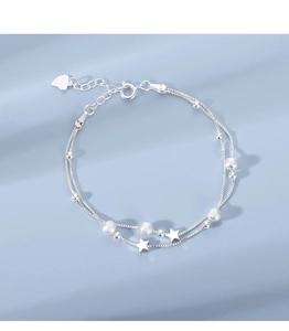 Detailed close-up of double-layer S925 silver star bracelet with beads and charms