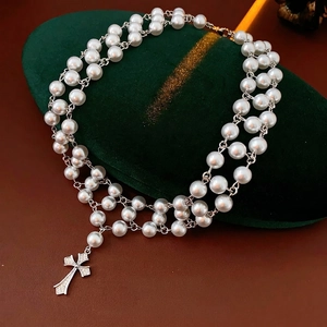 French vintage double-layer pearl necklace with a sparkling silver cross pendant