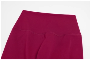 Close-up of wine red yoga shorts with high waist and decorative wavy reinforced stitching