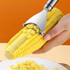 Manual stainless steel corn peeler tool with sharp blade for efficient kernel removal