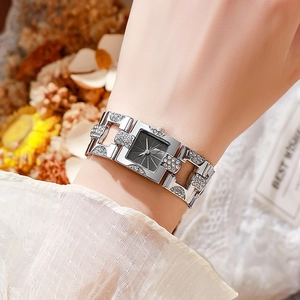Elegant square silver watch for women with rhinestones and black dial on wrist