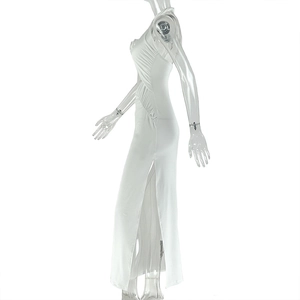 Detailed side view of a white ruched maxi dress with elegant side slit and sleek fabric