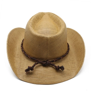 Detail of woven straw cowboy hat with brown leather band and tassel accents