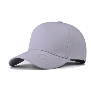 Detailed close-up of gray five-panel baseball cap with reinforced stitching on curved brim