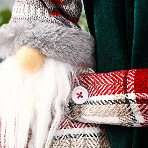 Detail of Christmas gnome curtain buckle with knitted texture and soft faux fur beard
