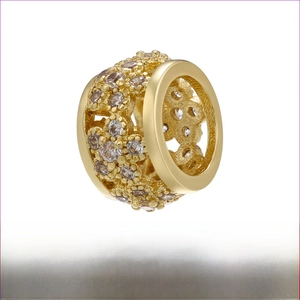 Detailed macro view of 18K gold-plated brass floral bead with sparkling rhinestones