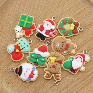 Colorful Christmas resin charms set including Santa, snowman and reindeer on wooden tray