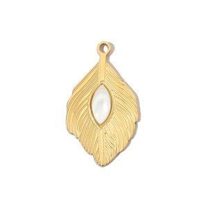 Detailed macro view of a golden feather pendant with a white marquise stone inlay