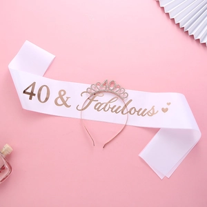 Close-up of a white 40 & Fabulous satin sash and a sparkling rhinestone 40th birthday tiara