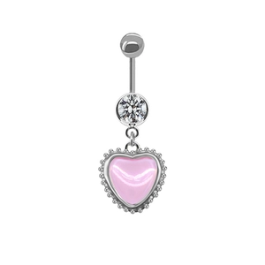 Detail of silver navel ring featuring a round clear gem and a pink heart pendant with bead trim