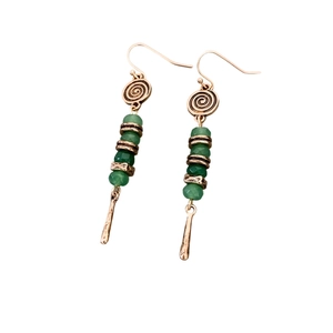 Bohemian drop earrings with green faceted beads and vintage metal spiral patterns