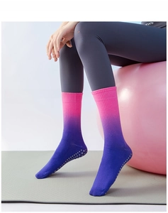 Detail of pink-purple gradient yoga socks with non-slip silicone grips on the sole