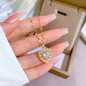 Elegant gold titanium necklace with a heart-shaped crystal pendant and dainty chain