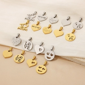 Detailed arrangement of 18K gold and silver heart pendants with MOM and Love engravings
