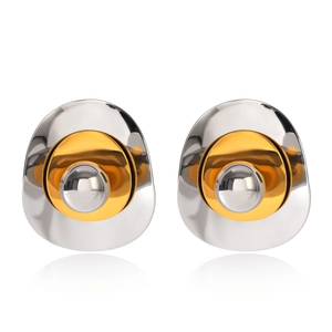 Macro view of polished two-tone nested earrings with silver and gold metallic layers