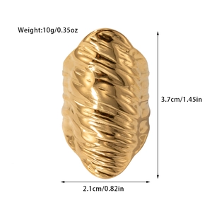 Detailed view of irregular hammered texture on gold titanium steel ring with size specs