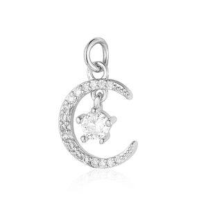Detailed view of a silver moon and star pendant with sparkling cubic zirconia inlay