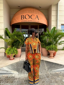Detail of African print two-piece set featuring V-neck top and wide-leg trousers