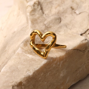 Golden irregular hammer texture heart ring in minimalist stainless steel design