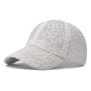 Close-up of lace mesh baseball cap featuring 3D floral patterns and breathable fabric