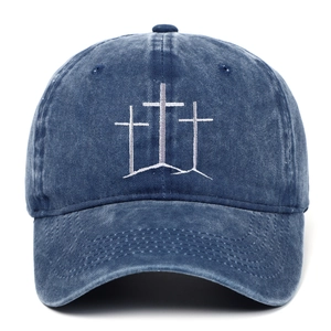 Detailed embroidery of three crosses on a vintage washed navy blue denim baseball cap