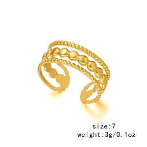Detailed view of layered gold cross ring size 7 weighing 3g with beaded and twisted bands