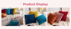 Detailed view of luxury pleated velvet pillow covers in multiple colors on a cream sofa