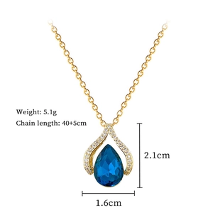 Detail of blue teardrop pendant with gold chain dimensions 2.1cm and 5.1g weight